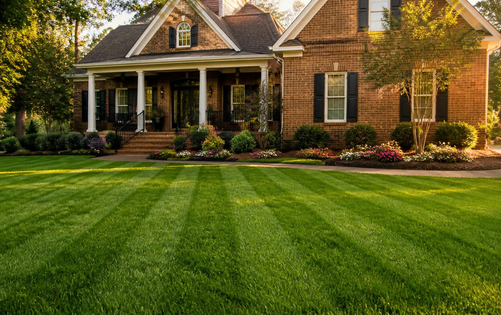 Freshly mowed and striped lawn with mulched flower beds in Moultrie, Georgia